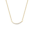 Gold necklace with small diamonds on a white background