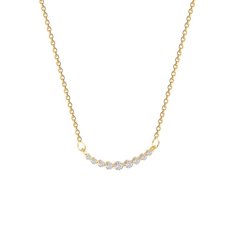 Gold necklace with small diamonds on a white background