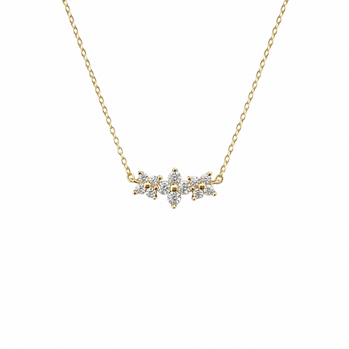 Gold necklace with a diamond pendant on a white background