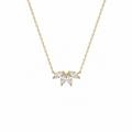 Gold necklace with a leaf-shaped pendant on a white background