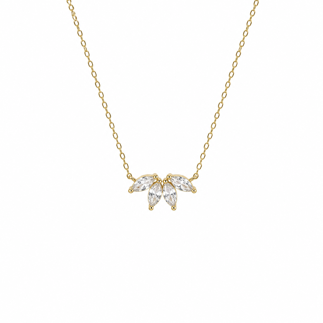 Gold necklace with a leaf-shaped pendant on a white background