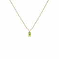 Gold necklace with a green gemstone pendant on a white background